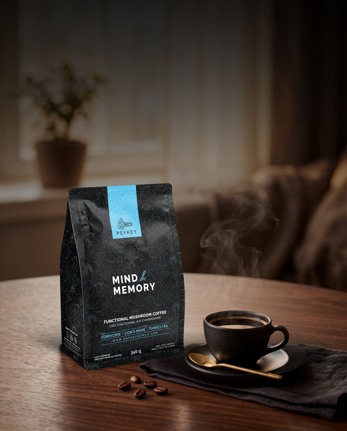 A high-angle view of whole roasted coffee beans surrounding a bag of PsyKey Mind & Memory functional mushroom coffee on a clean surface.